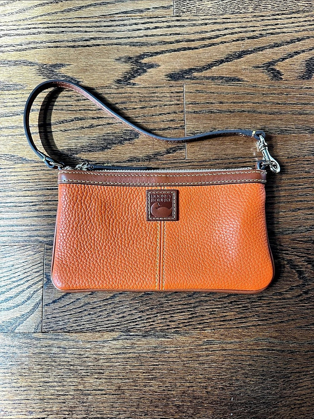 Dooney & Bourke Pebble Grain Small Zip Wristlet in Orange